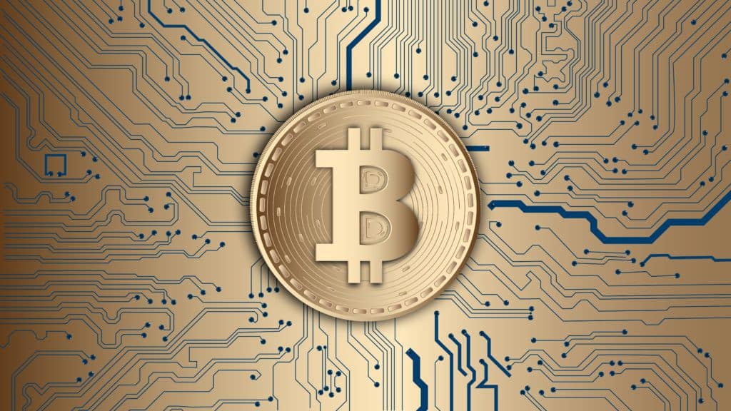 20 Best Bitcoin Wallpapers 12 Bitcoin on a gold circuit board.